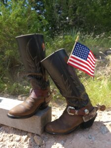 Brown leather custom-made boots with spurs built by Guy Spikes